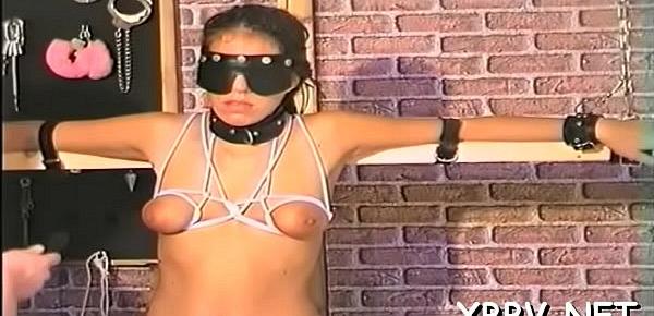  Naked honey stands with her big boobs tied up in ropes
